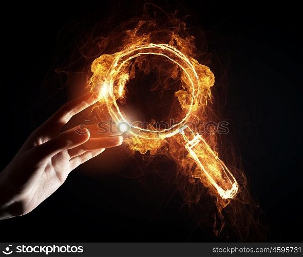 Fire search icon. Finger touch glowing light search icon on dark background
