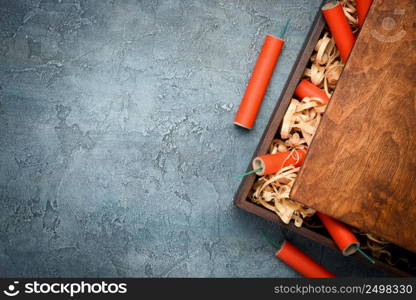 Firecrackers in wooden box filled with wood shavings. Tnt crate.