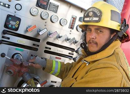 Firefighter operating engine