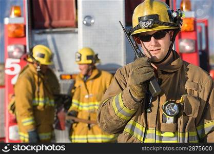 Firefighter using walkie talkie