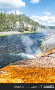 Firehole River in Yellowstone. Waterfalls of hot water.