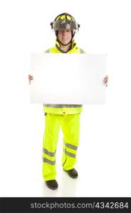 Fireman holding a blank white sign. Full body isolated on white.