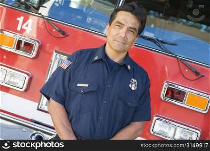 Fireman standing in front of fire engine