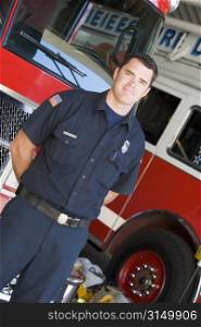 Fireman standing in front of fire engines