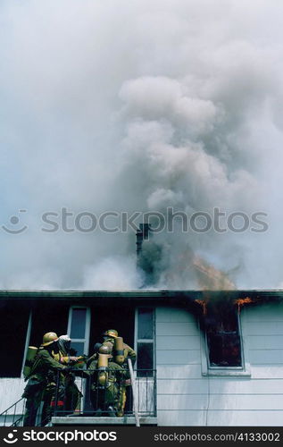 Firemen at work on a burning house in Maryland