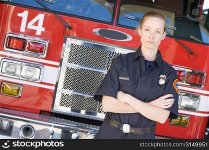 Firewoman standing in front of fire engine
