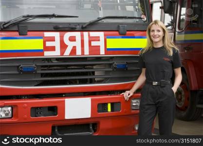 Firewoman standing in front of fire engine