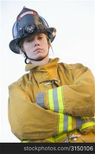 Firewoman standing outdoors wearing helmet