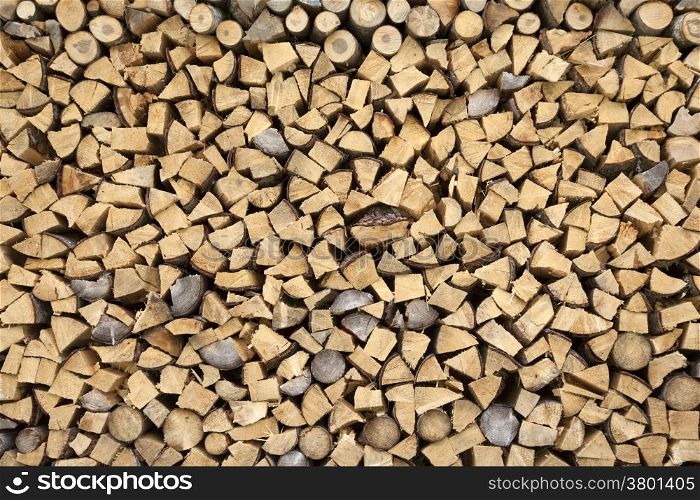 firewood on a pile drying for use in winter