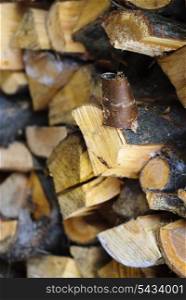 Firewoods after the sawing wood stand on timberyard. Bark close up. Shallow deep of field.
