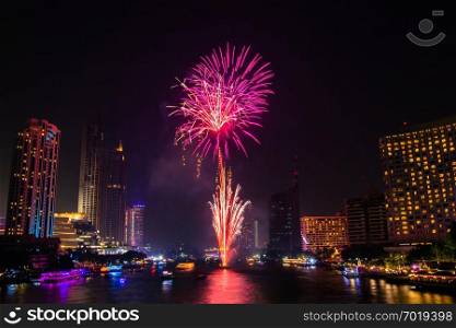 Firework colorful on night city view background for celebration festival. Select focus