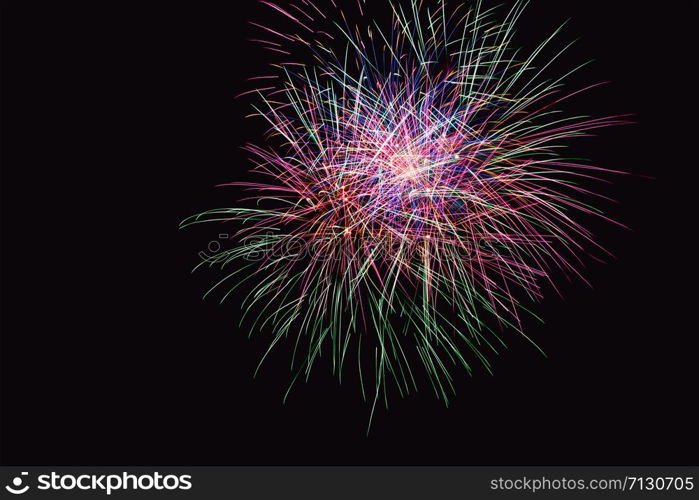 Fireworks abstract on dark background. Colorful firework on the night sky. New Year celebration fireworks. Abstract firework on black background with free space for text