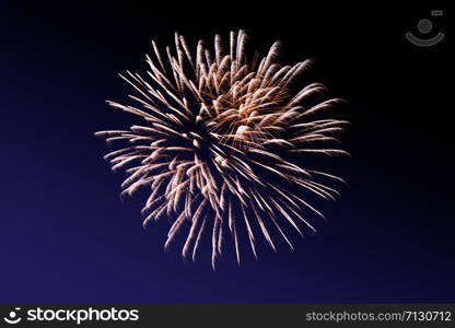 Fireworks abstract on dark background. Colorful firework on the night sky. New Year celebration fireworks. Abstract firework on black background with free space for text