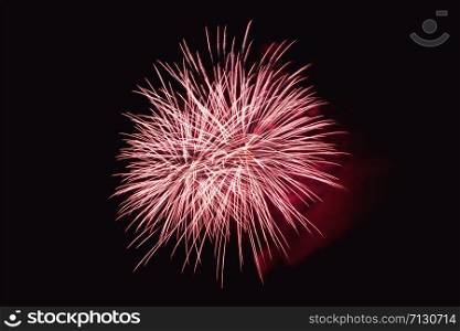 Fireworks abstract on dark background. Colorful firework on the night sky. New Year celebration fireworks. Abstract firework on black background with free space for text