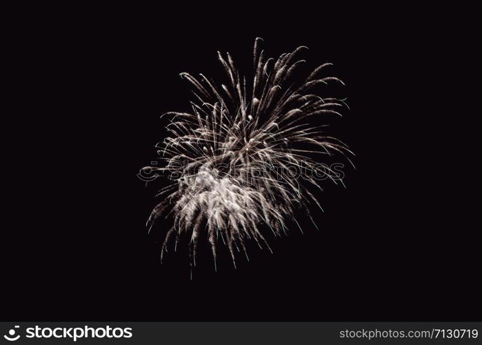 Fireworks abstract on dark background. Colorful firework on the night sky. New Year celebration fireworks. Abstract firework on black background with free space for text