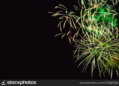 Fireworks abstract on dark background.Colorful firework on the night sky. New Year celebration fireworks. Abstract firework on black background with free space for text