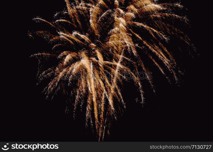 Fireworks abstract on dark background. Colorful firework on the night sky. New Year celebration fireworks. Abstract firework on black background with free space for text