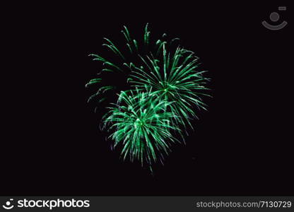 Fireworks abstract on dark background. Colorful firework on the night sky. New Year celebration fireworks. Abstract firework on black background with free space for text