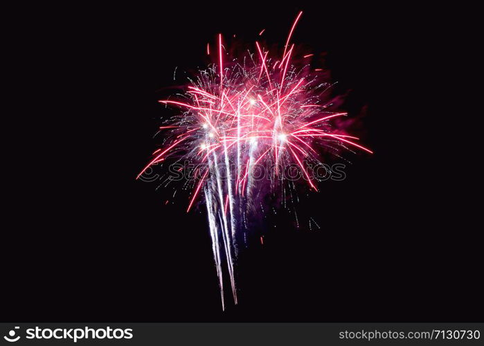 Fireworks abstract on dark background.Colorful firework on the night sky. New Year celebration fireworks. Abstract firework on black background with free space for text