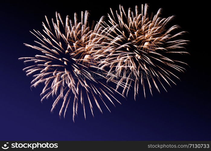 Fireworks abstract on dark background. Colorful firework on the night sky. New Year celebration fireworks. Abstract firework on black background with free space for text