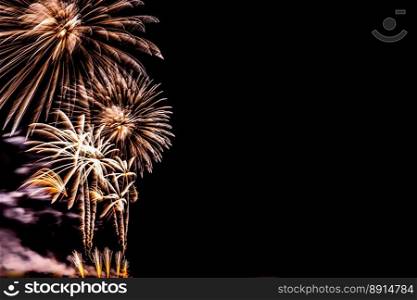 Fireworks banner. Copy space. New Year and Celebration banner. Sparks salute isolated on black background. Festive banner with flashes of fireworks