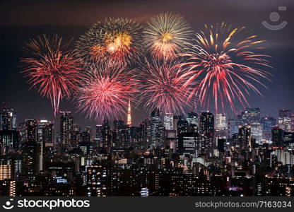 Fireworks celebrating over Tokyo cityscape at night, Japan