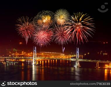 Fireworks celebrating over Yokohama Bay Bridge at night, Japan