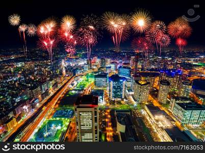 Fireworks celebrating over Yokohama cityscape at night, Japan