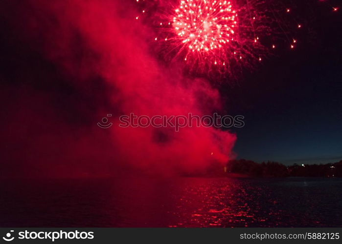 Fireworks display at night on Canada Day, Kenora, Lake Of The Woods, Ontario, Canada