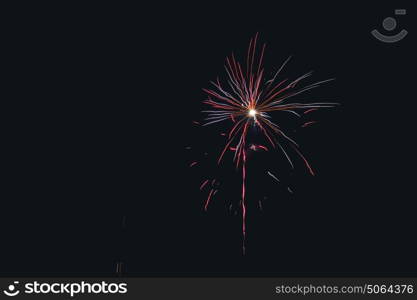 Fireworks exploding in the night sky in colorful colors at new years eve