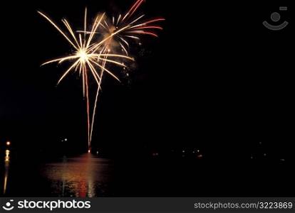 Fireworks Exploding Over Lake