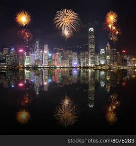 Fireworks Festival over Hong Kong city with water reflection, view from Victoria Harbour
