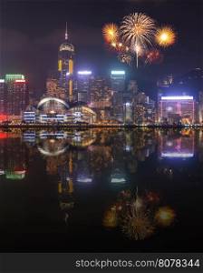 Fireworks Festival over Hong Kong city with water reflection, view from Victoria Harbour