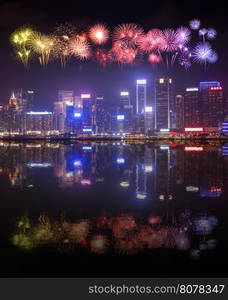 Fireworks Festival over Hong Kong city with water reflection, view from Victoria Harbour