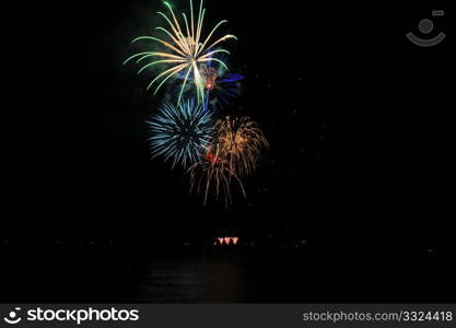 Fireworks In A Rainbow Of Colors. Colorful nighttime fireworks against a solid black sky over Lake Tahoe on the fourth of July holiday 2010