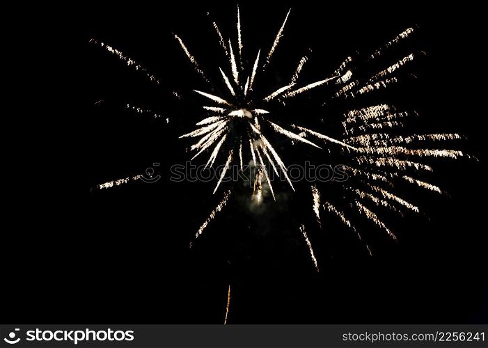 Fireworks in Happy New Year 2020. Holiday festival celebration. Fireworks display on dark sky background.