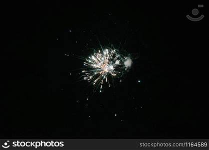 Fireworks in the night sky. Multicolored fireworks. Fireworks in the night sky. Multicolored fireworks at night