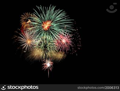Fireworks light up the black sky with dazzling fireworks exploding display