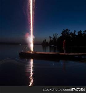 Fireworks on dock, Lake of The Woods, Ontario, Canada