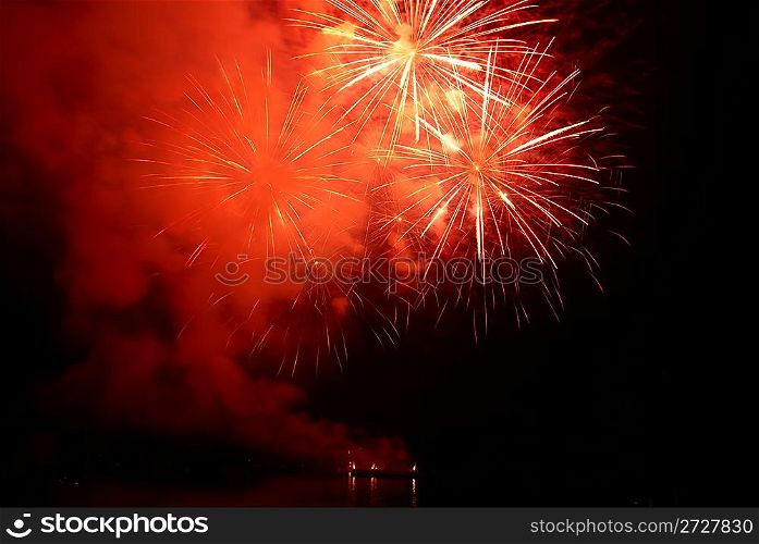 Fireworks, salute on the black sky background