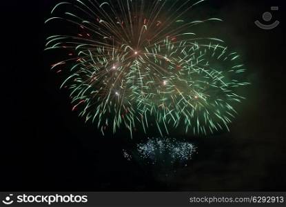Fireworks, salute on the black sky background