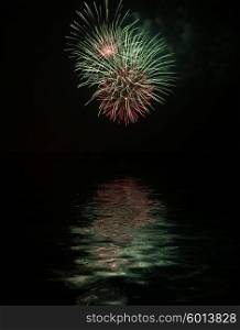 Fireworks with reflexes on water