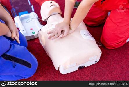 First aid and CPR class using automated external defibrillator device - AED