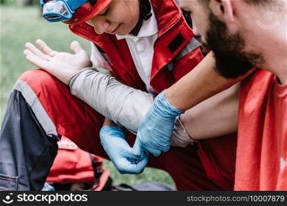 First aid paramedic in training, treating third degree burns