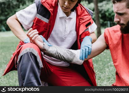 First aid paramedic in training, treating third degree burns