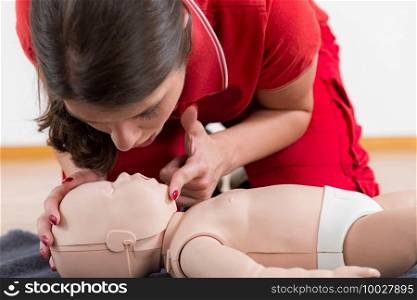 First Aid Training - Cardiopulmonary resuscitation. First aid course on baby dummy