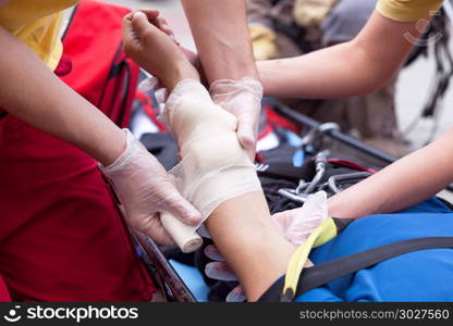First aid training. Hand bandaging.
