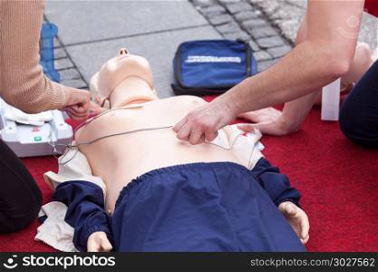 First aid training using automated external defibrillator device