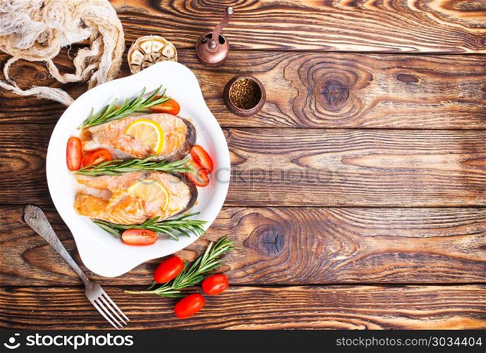 fish. baked fish, baked fish with vegetables on plate