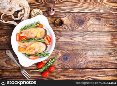 fish. baked fish, baked fish with vegetables on plate